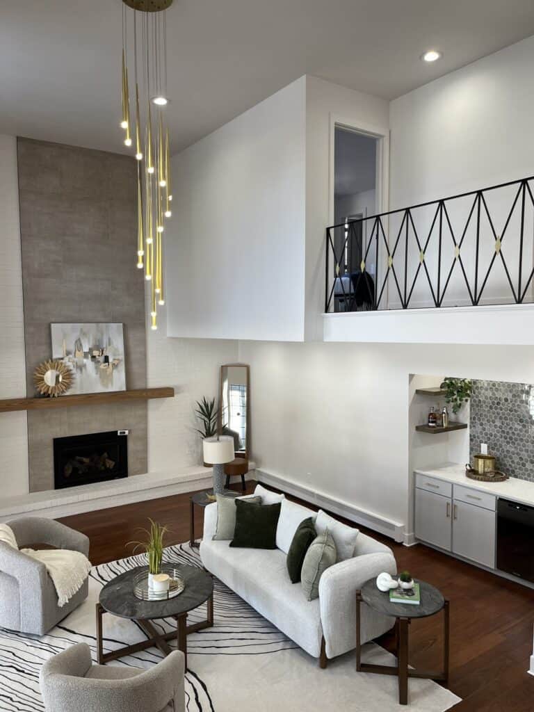 Interior living room painting Colorado Springs – bright modern space with white walls, fireplace, and contemporary lighting